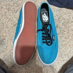 Turquoise vans.